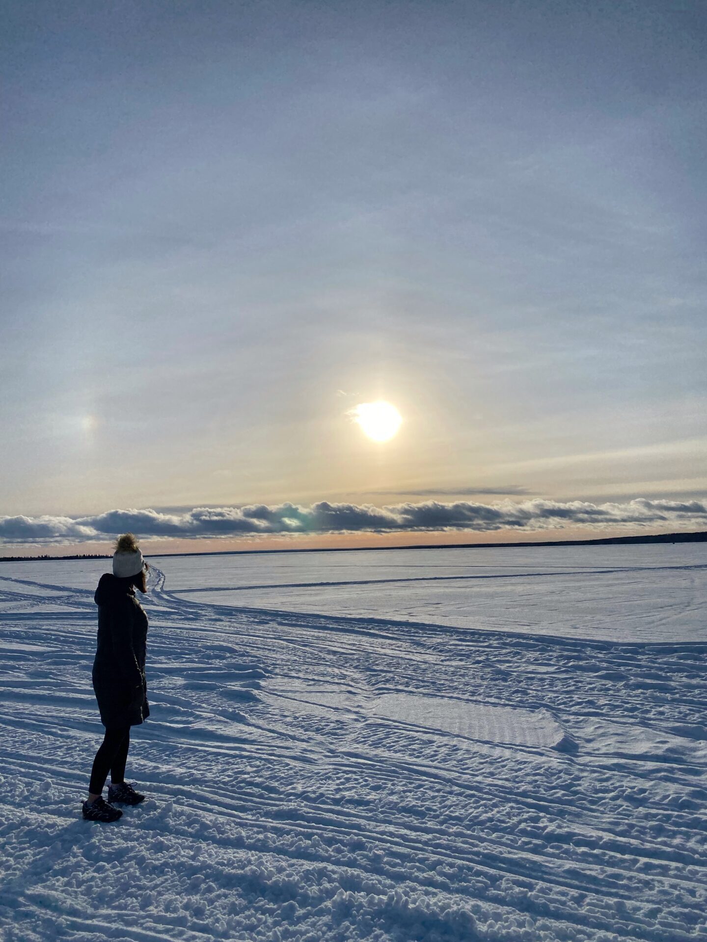 Sunset on ice covered lake